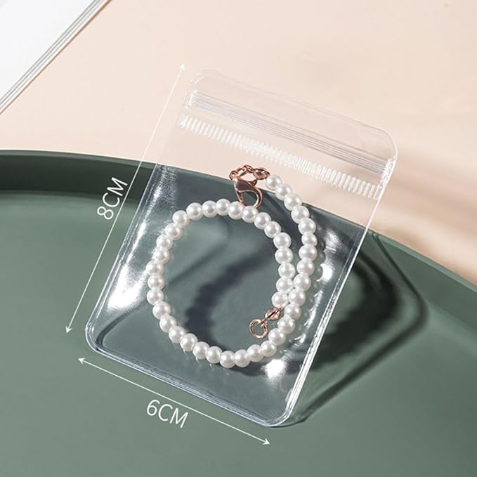 esowemsn Clear Jewelry Storage Book 160 Slots PVC Jewelry Storage Album with 40pcs Zipper Bag Ziplock Jewelry Bags Portable Travel Jewelry Organizer Bag for Rings,Necklace,Bracelets,Stud,Earrings