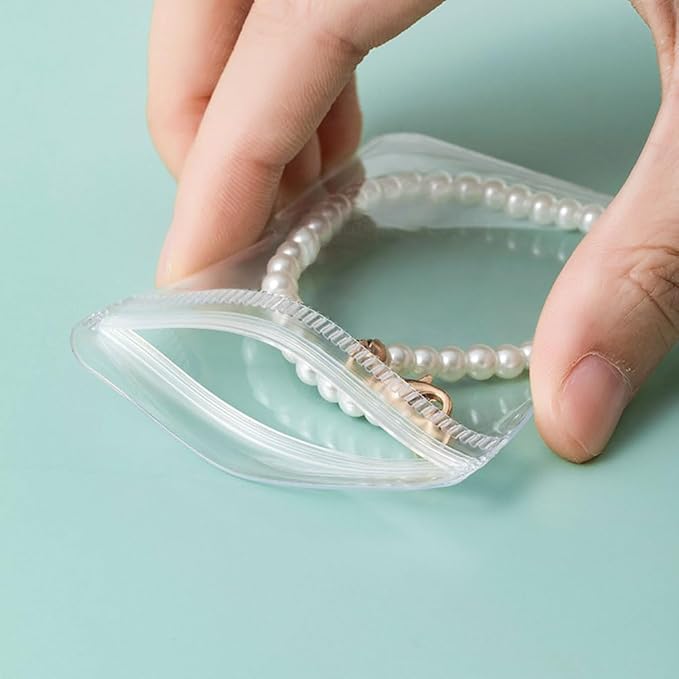 esowemsn Clear Jewelry Storage Book 160 Slots PVC Jewelry Storage Album with 40pcs Zipper Bag Ziplock Jewelry Bags Portable Travel Jewelry Organizer Bag for Rings,Necklace,Bracelets,Stud,Earrings