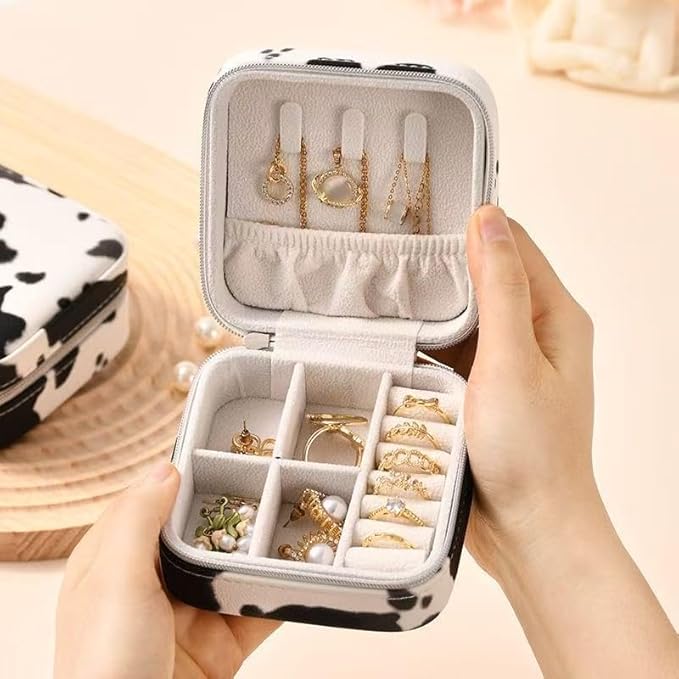 Jinglong Cattleprint Travel Jewelry Box, Compact and Adorable Doggy Jewelry Organizer, Suitable for Rings, Necklaces, and Earrings, Portable Jewelry Storage Box (Black and white cow pattern)